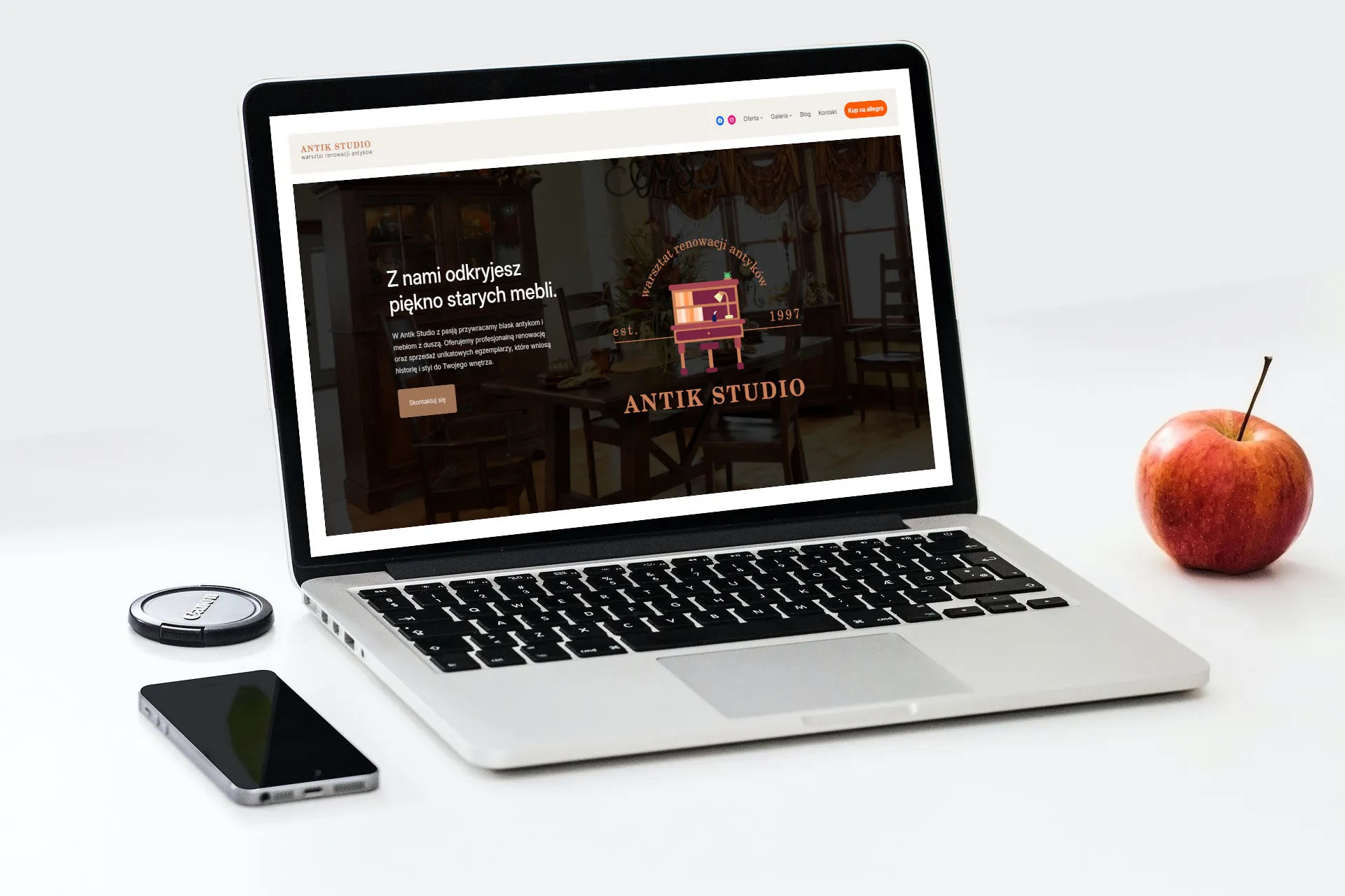 Image of a laptop with modern antik-studio.pl website open